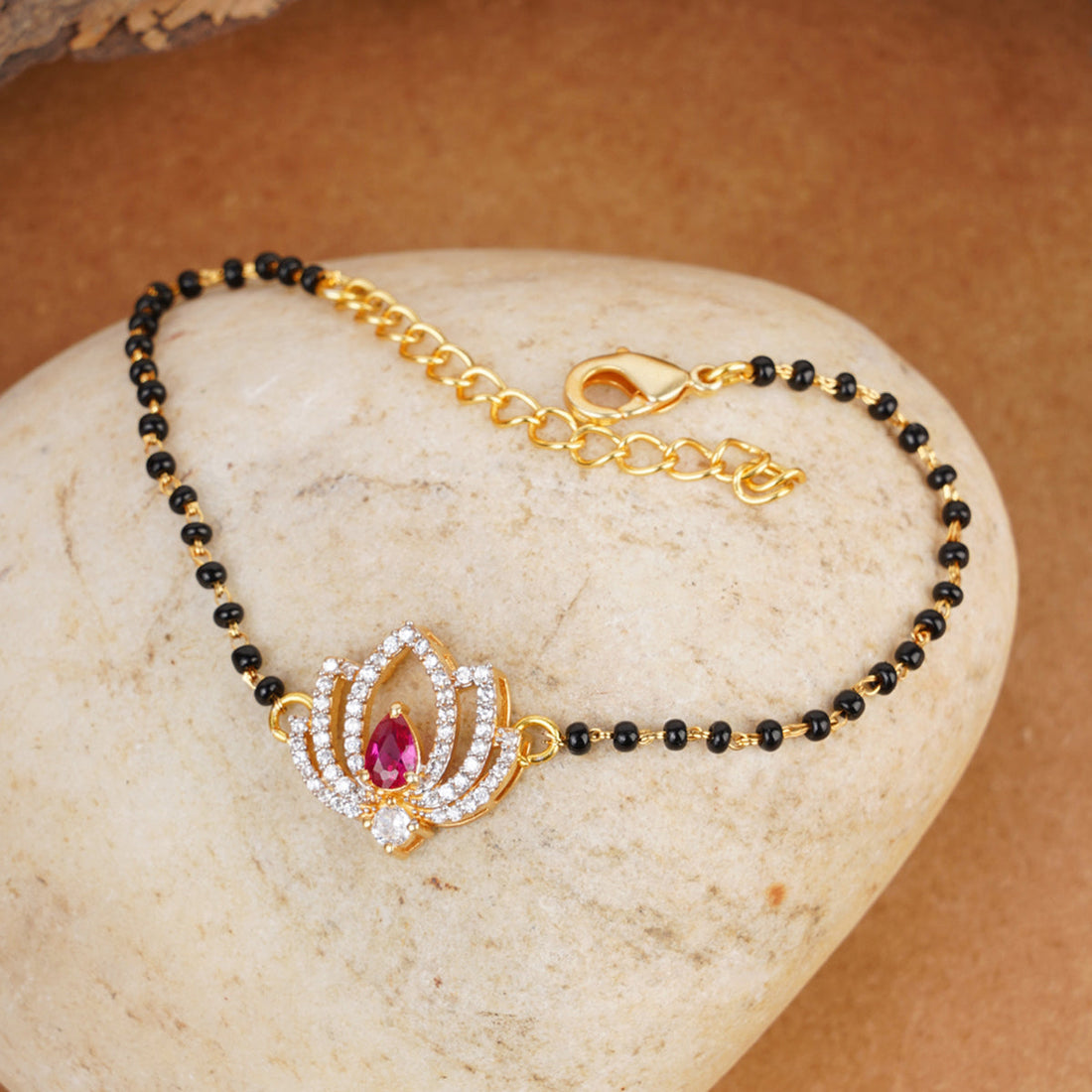 Shimmering Floret American Diamond CZ Golden Brass Black Beaded Mangalsutra Bracelet
