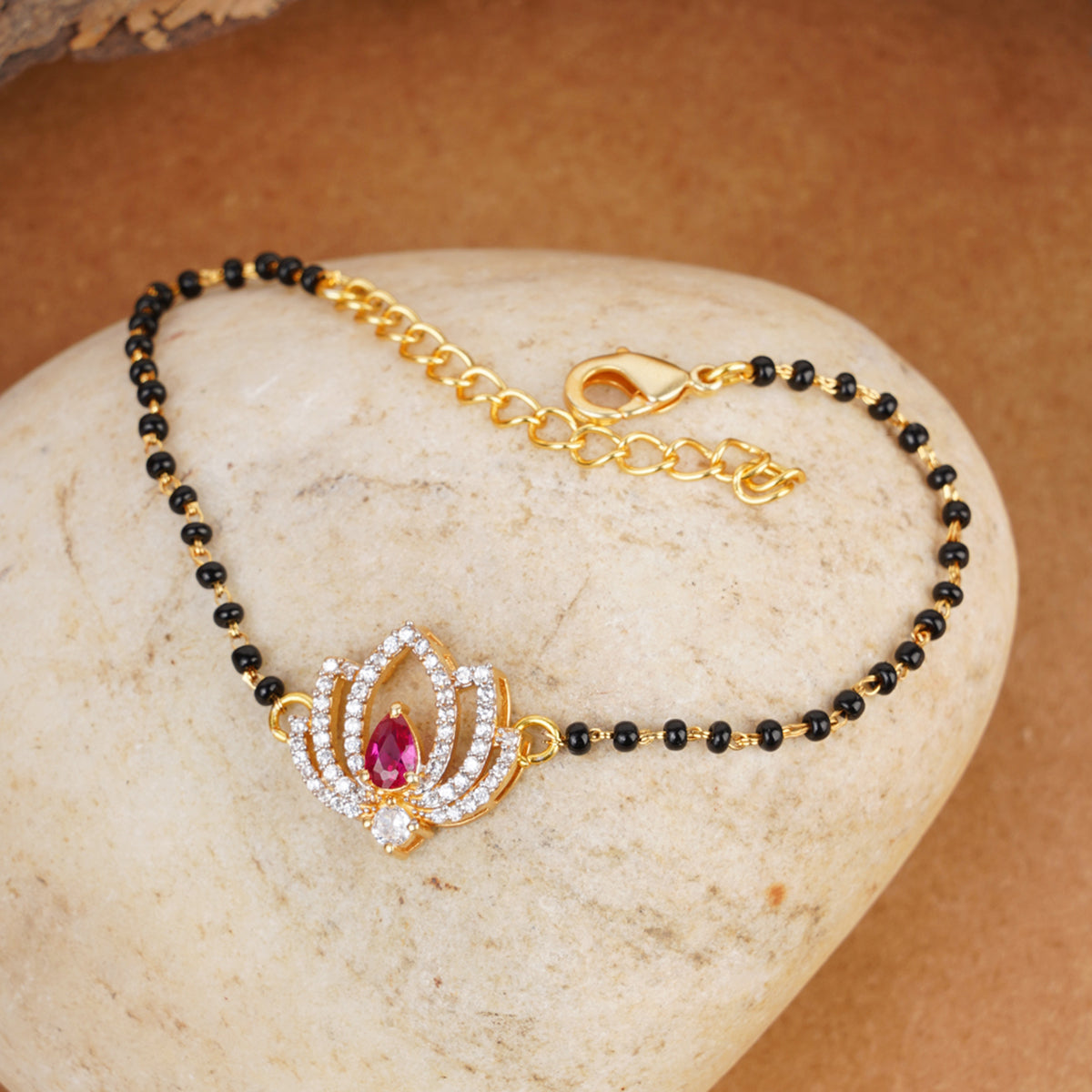 Shimmering Floret American Diamond CZ Golden Brass Black Beaded Mangalsutra Bracelet